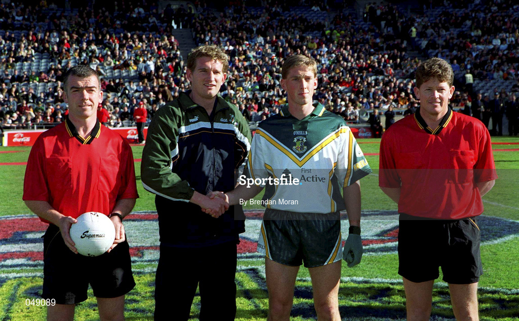 15 October 2000; Team captains Trevor Giles of Ireland and James Hird of Australia shake hands next to referees Pat McEneaney, left, and Brett Allen prior to the International Rules Series Second Test match between Ireland and Australia at Croke Park in Dublin. Photo by Brendan Moran/Sportsfile