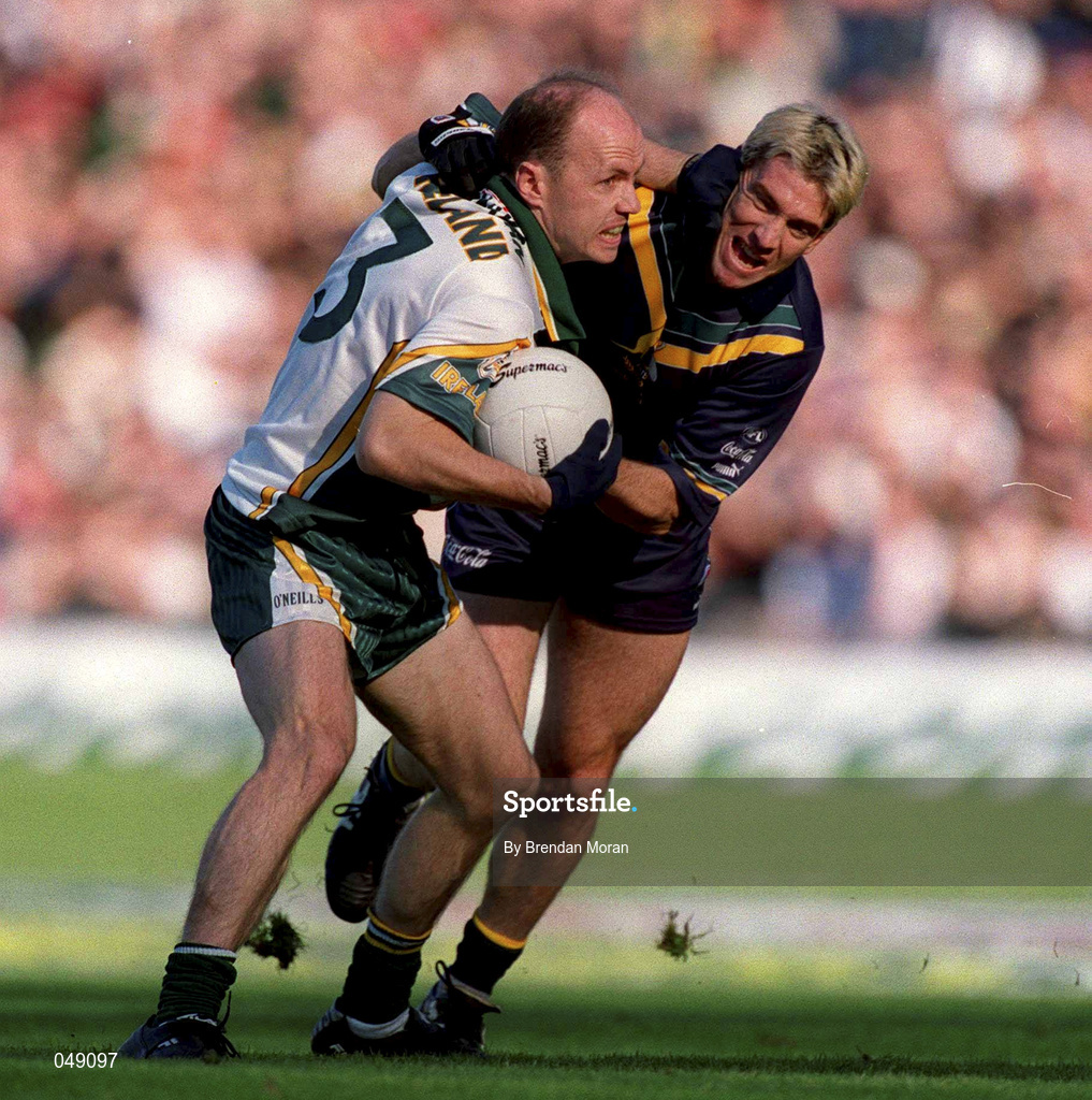 15 October 2000; Peter Canavan of Ireland in action against Jason Akermanis of Australia during the International Rules Series Second Test match between Ireland and Australia at Croke Park in Dublin. Photo by Brendan Moran/Sportsfile