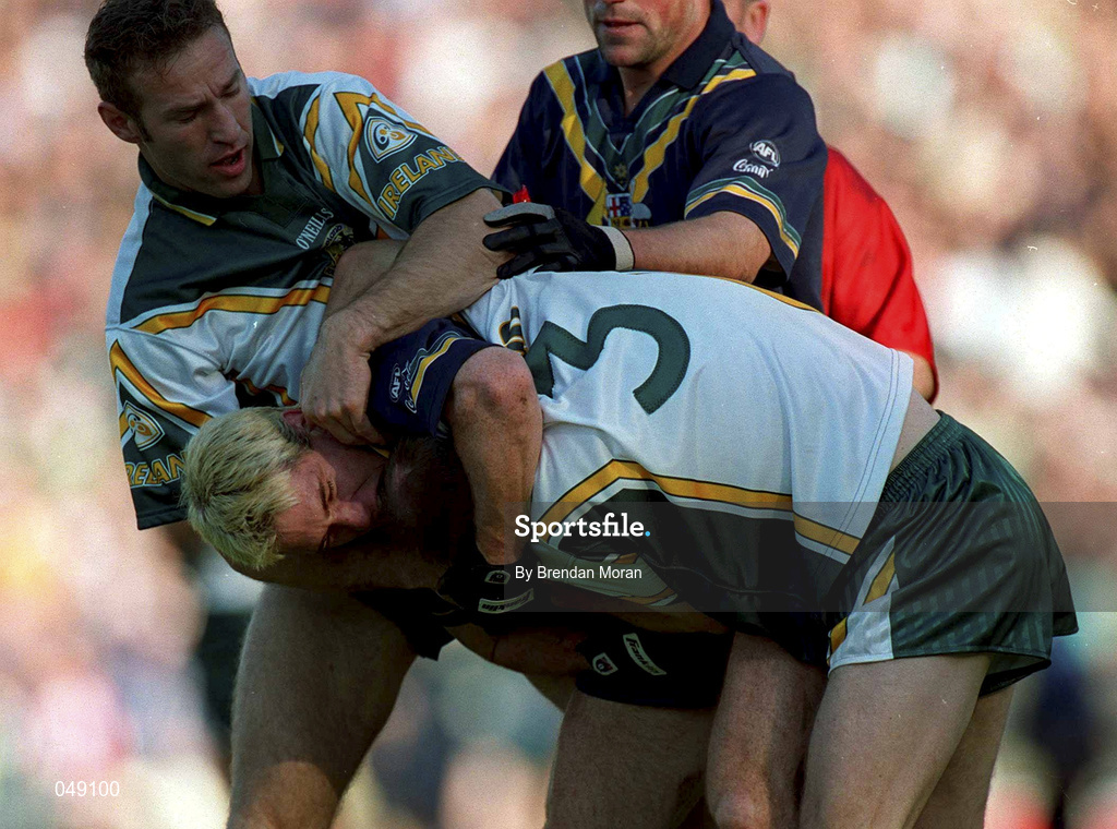 15 October 2000; Jason Akermanis of Australia in action against Peter Canavan of Ireland during the International Rules Series Second Test match between Ireland and Australia at Croke Park in Dublin. Photo by Brendan Moran/Sportsfile