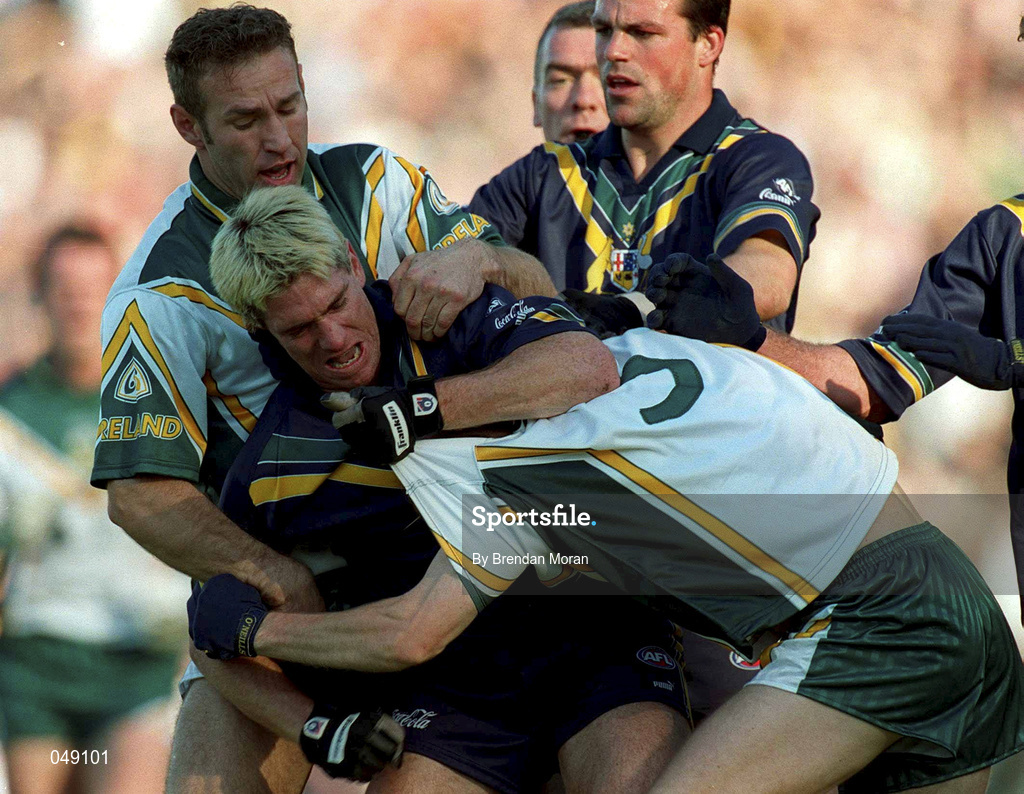 15 October 2000; Jason Akermanis of Australia in action against Peter Canavan of Ireland during the International Rules Series Second Test match between Ireland and Australia at Croke Park in Dublin. Photo by Brendan Moran/Sportsfile