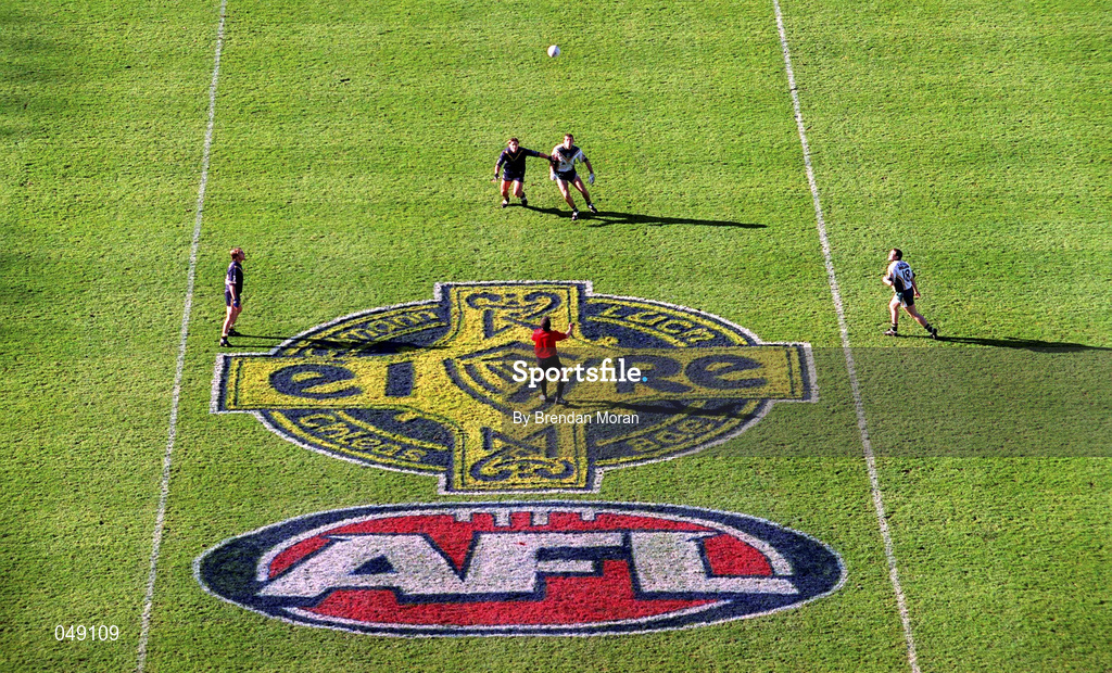 15 October 2000; Referee Pat McEneaney throws the ball in between Anthony Tohill of Ireland and Trent Coad of Australia during the International Rules Series Second Test match between Ireland and Australia at Croke Park in Dublin. Photo by Brendan Moran/Sportsfile