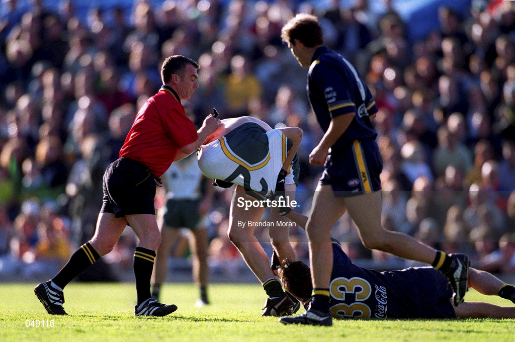 15 October 2000; Referee Pat McEneaney splits up Ciaran McManus of Ireland and Blake Caracella of Australia during the International Rules Series Second Test match between Ireland and Australia at Croke Park in Dublin. Photo by Brendan Moran/Sportsfile