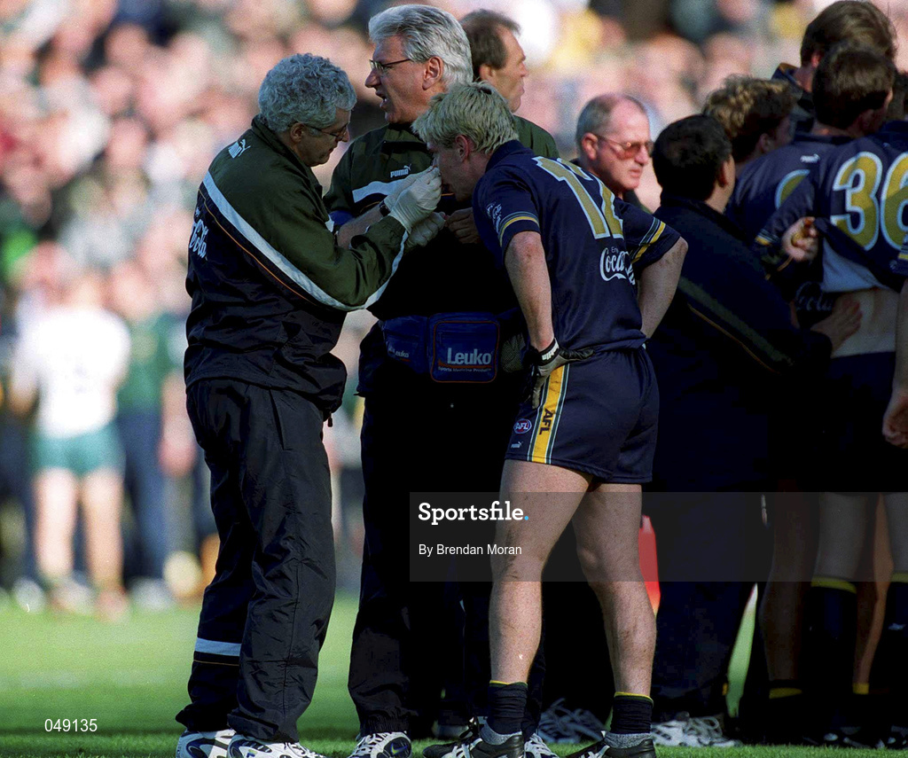 15 October 2000; Jason Akermanis of Australia receives treatment during the International Rules Series Second Test match between Ireland and Australia at Croke Park in Dublin. Photo by Brendan Moran/Sportsfile