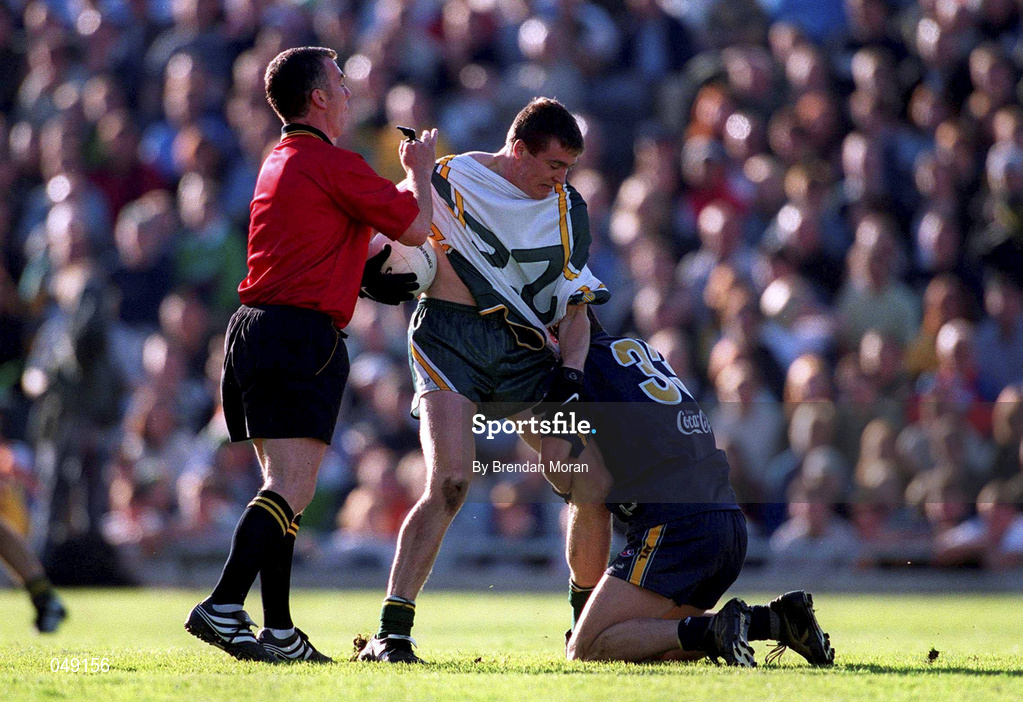 15 October 2000; Referee Pat McEneaney breaks up Ciaran McManus of Ireland and Blake Caracella of Australia during the International Rules Series Second Test match between Ireland and Australia at Croke Park in Dublin. Photo by Brendan Moran/Sportsfile