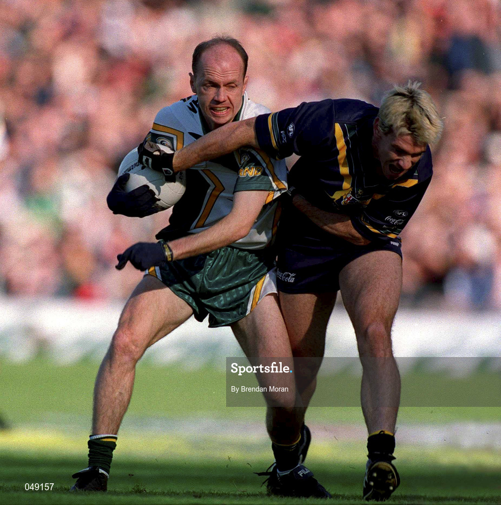 15 October 2000; Peter Canavan of Ireland in action against Jason Akermanis of Australia during the International Rules Series Second Test match between Ireland and Australia at Croke Park in Dublin. Photo by Brendan Moran/Sportsfile