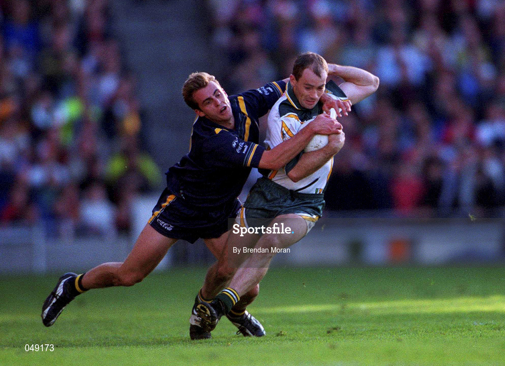 15 October 2000; Finbar Cullen of Ireland in action against Justin Blumfield of Australia during the International Rules Series Second Test match between Ireland and Australia at Croke Park in Dublin. Photo by Brendan Moran/Sportsfile
