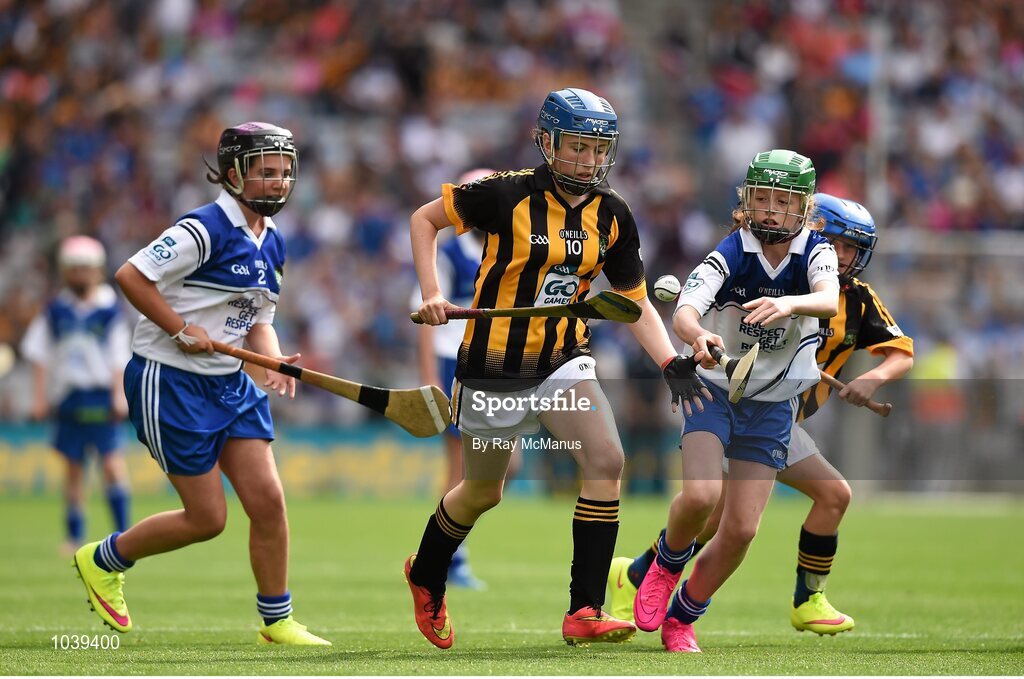 9 August 2015; Katie Quinlivan, Loreto PS, Rathfarnham, Dublin 14, representing Kilkenny, in action against Caolfhionn Ní Mhuilleoir, Gaelscoil Uí Fhiach, Maigh Nuad, Cill Dar, left, and Lucy O’Kane, St Johns PS, Coleraine, Derry, representing Waterford, during the Cumann na mBunscol INTO Respect Exhibition Go Games 2015 at Kilkenny v Waterford - GAA Hurling All-Ireland Senior Championship Semi-Final. Croke Park, Dublin. Picture credit: Ray McManus / SPORTSFILE