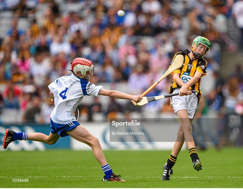 9 August 2015; Ian Byrne, Glenmore NS, Kilkenny, representing Kilkenny, in action against Michael Staunton, Naomh Ceitheach SN, Ballymacurley, Roscommon, representing Waterford, during the Cumann na mBunscol INTO Respect Exhibition Go Games 2015 at Kilkenny v Waterford - GAA Hurling All-Ireland Senior Championship Semi-Final. Croke Park, Dublin. Picture credit: Stephen McCarthy / SPORTSFILE