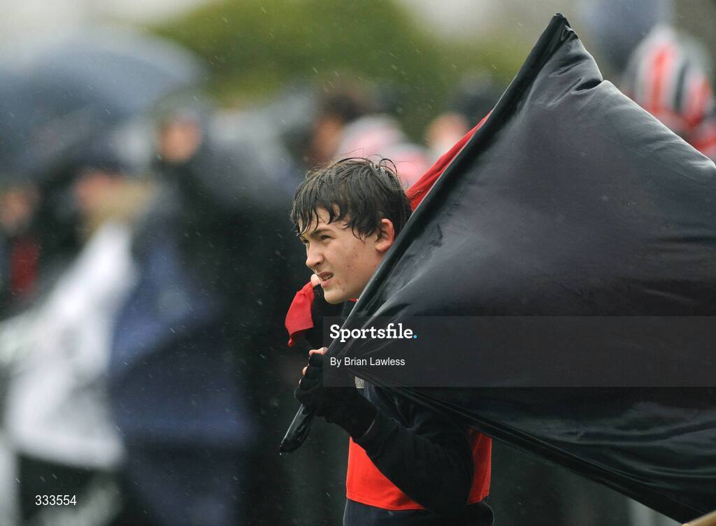 14 January 2009; A Wesley College supporter braves the bad weather during the match. Leinster Schools Vinnie Murray Senior Cup First Round - Section B, Newpark v Wesley College, Kiltiernan, Co. Dublin. Picture credit: Brian Lawless / SPORTSFILE