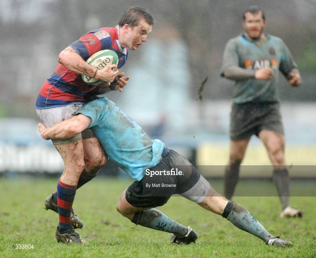 17 January 2009; Michael Keating, Clontarf, is tackled by Kevin Corke, UCD. AIB League Division 1, Clontarf v UCD, Castle Avenue, Clontarf, Dublin. Picture credit: Matt Browne / SPORTSFILE