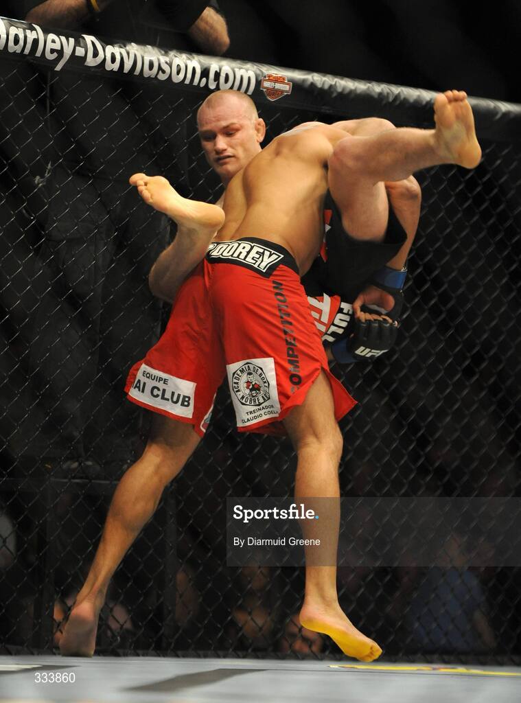 17 January 2009; Martin "The Hitman" Kampmann is picked up by Alexandre Barros before being slammed to the canvas during their welterweight bout. UFC 93, Ultimate Fighting Championship, The O2, Dublin. Picture credit: Diarmuid Greene / SPORTSFILE