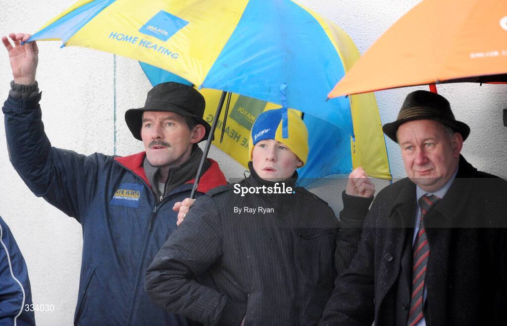18 January 2009; Spectators take cover as they watch the match. FBD League, Section A, Mayo v Roscommon, Ballyhaunis GAA Club, Ballyhaunis, Co. Mayo. Picture credit: Ray Ryan / SPORTSFILE
