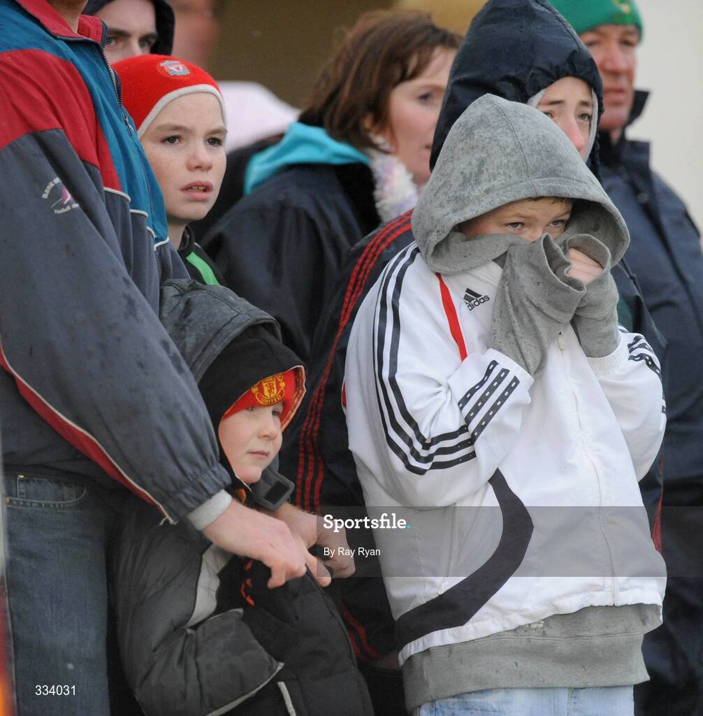 18 January 2009; Spectators take cover as they watch the match. FBD League, Section A, Mayo v Roscommon, Ballyhaunis GAA Club, Ballyhaunis, Co. Mayo. Picture credit: Ray Ryan / SPORTSFILE