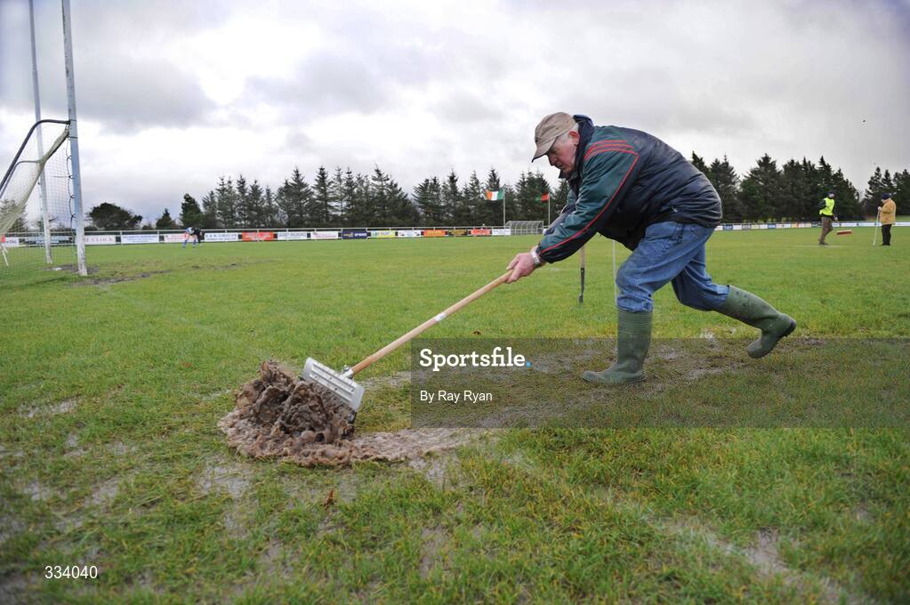 18 January 2009; Steward Hugh Rudden removes the excess water from the pitch before the match. FBD League, Section A, Mayo v Roscommon, Ballyhaunis GAA Club, Ballyhaunis, Co. Mayo. Picture credit: Ray Ryan / SPORTSFILE