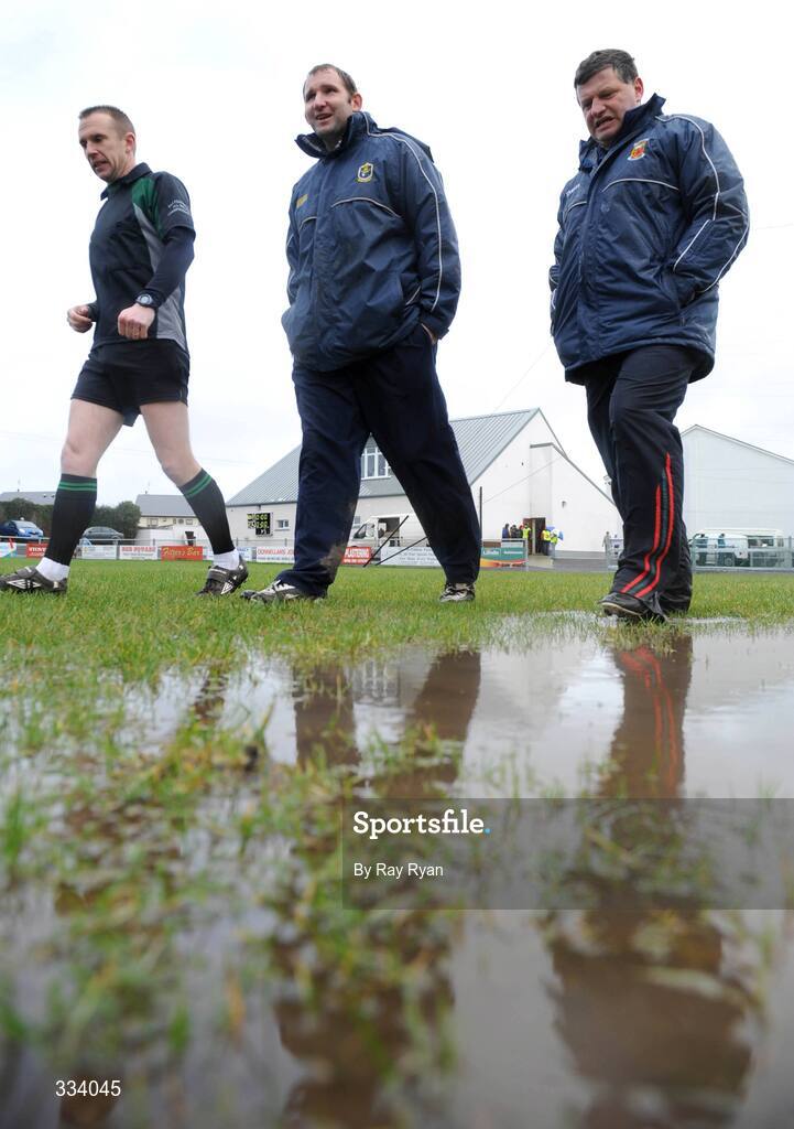 18 January 2009; Referee Michael Duffy with managers Fergal O'Donnell and John O'Mahony inspect the water on the pitch before the match. FBD League, Section A, Mayo v Roscommon, Ballyhaunis GAA Club, Ballyhaunis, Co. Mayo. Picture credit: Ray Ryan / SPORTSFILE
