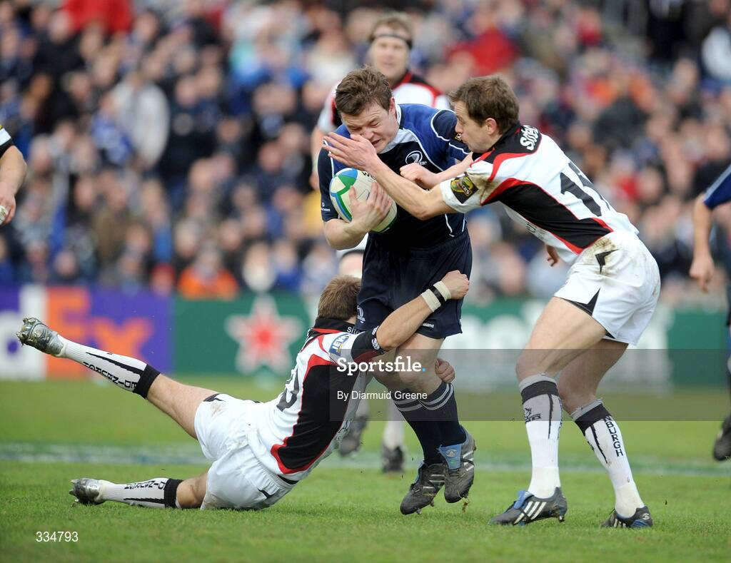 25 January 2009; Brian O'Driscoll, Leinster, is tackled by David Blair, left, and Chris Paterson, Edinburgh. Heineken Cup, Pool 2, Round 6, Leinster v Edinburgh, RDS, Dublin. Picture credit: Diarmuid Greene / SPORTSFILE