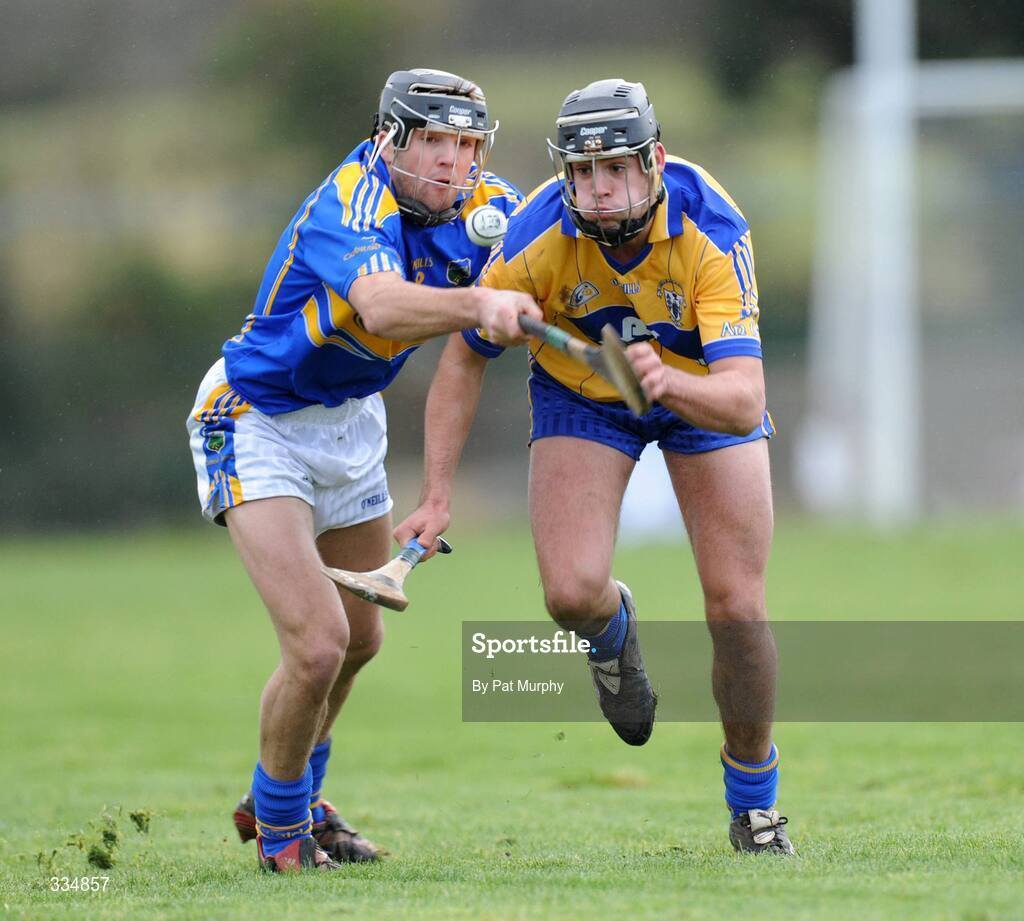 25 January 2009; Brendan Bugler, Clare, in action against James Woodlock, Tipperary. Waterford Crystal Cup Hurling Final, Clare v Tipperary, Ogonnolloe, Co. Clare. Picture credit: Pat Murphy / SPORTSFILE