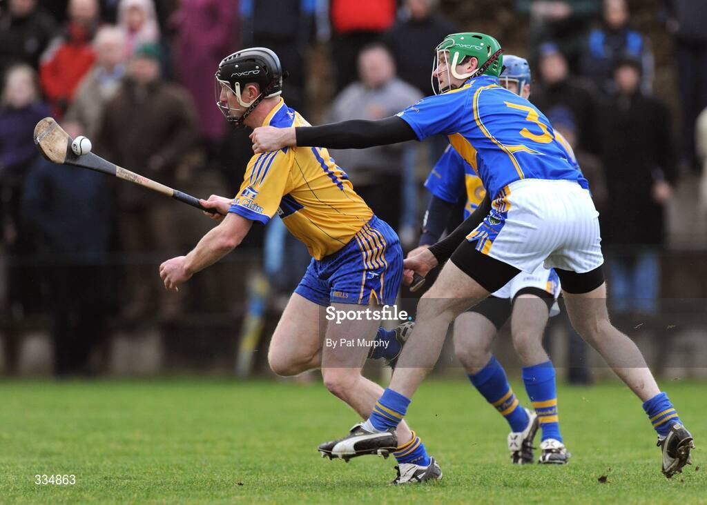25 January 2009; Niall Gilligan, Clare, in action against Declan Fanning, Tipperary. Waterford Crystal Cup Hurling Final, Clare v Tipperary, Ogonnolloe, Co. Clare. Picture credit: Pat Murphy / SPORTSFILE
