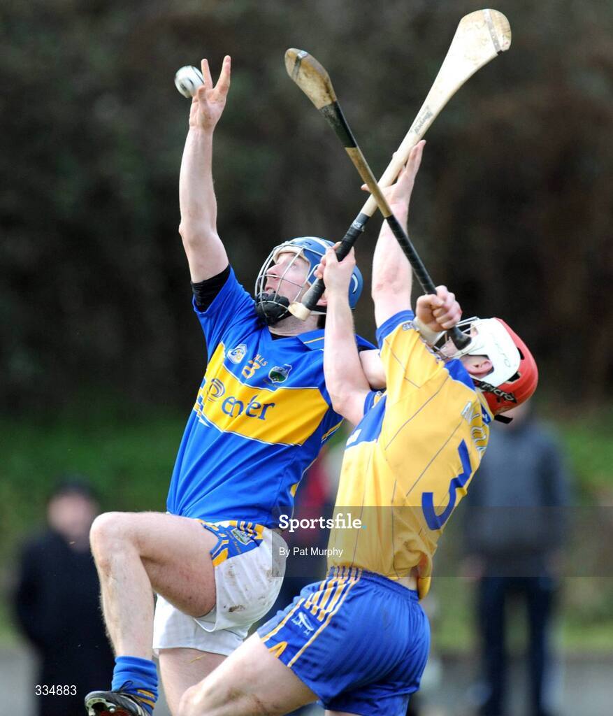 25 January 2009; John O'Brien, Tipperary, in action against Cathal Dillon, Clare. Waterford Crystal Cup Hurling Final, Clare v Tipperary, Ogonnolloe, Co. Clare. Picture credit: Pat Murphy / SPORTSFILE