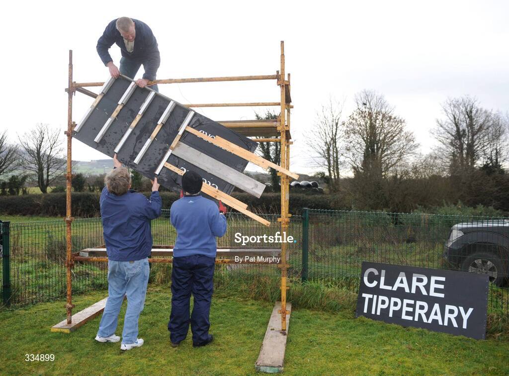 25 January 2009; Groundsmen Pat Rice, right, Brian O'Neill, left, and Michael Bryan construct the scoreboard before the game. Waterford Crystal Cup Hurling Final, Clare v Tipperary, Ogonnolloe, Co. Clare. Picture credit: Pat Murphy / SPORTSFILE