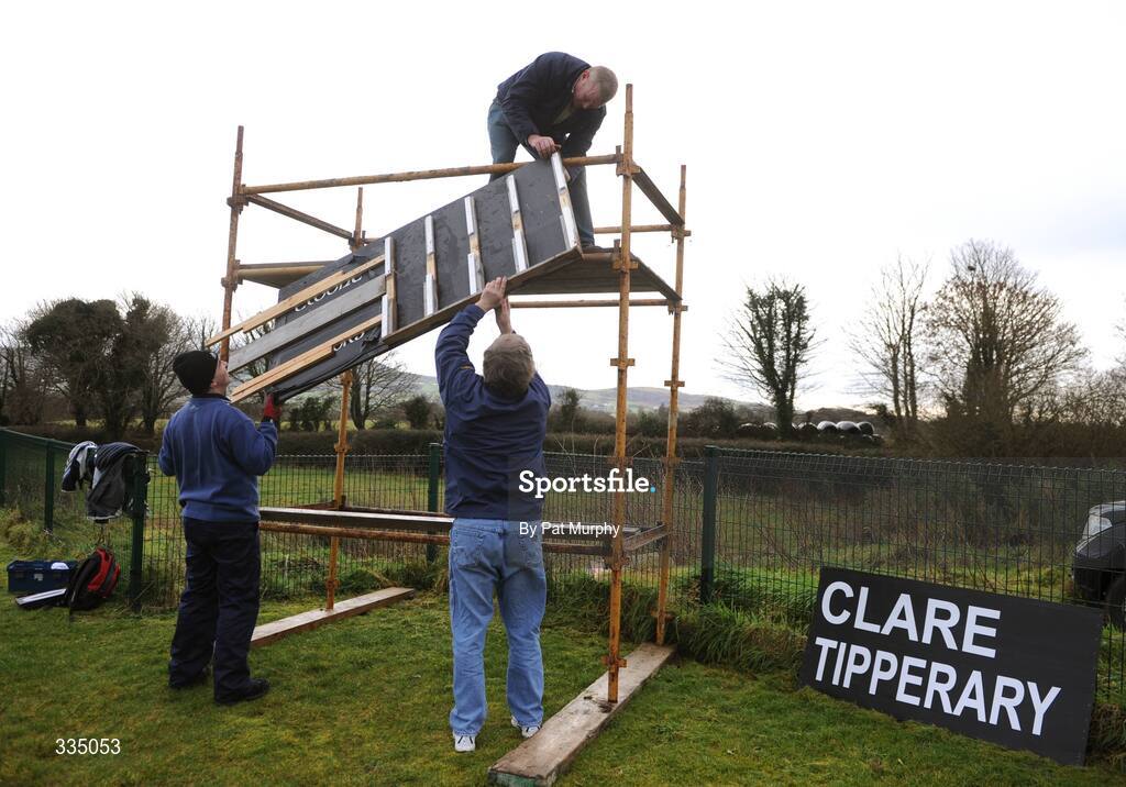 25 January 2009; Groundsmen Pat Rice, Brian O'Neill, right, and Michael Bryan, top, construct the scoreboard before the game. Waterford Crystal Cup Hurling Final, Clare v Tipperary, Ogonnolloe, Co. Clare. Picture credit: Pat Murphy / SPORTSFILE