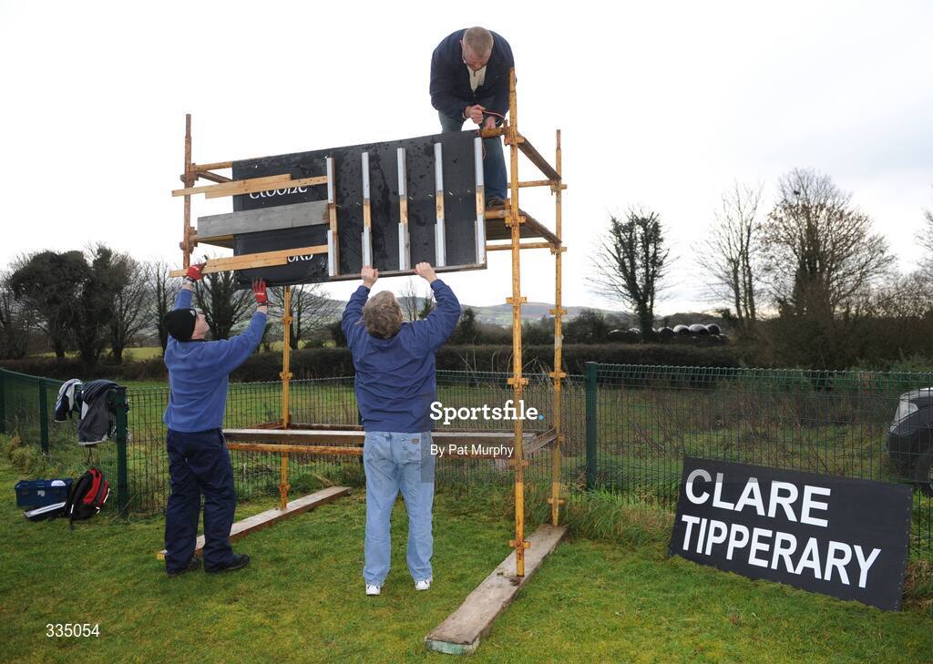 25 January 2009; Groundsmen Pat Rice, Brian O'Neill, left, and Michael Bryan, top, construct the scoreboard before the game. Waterford Crystal Cup Hurling Final, Clare v Tipperary, Ogonnolloe, Co. Clare. Picture credit: Pat Murphy / SPORTSFILE
