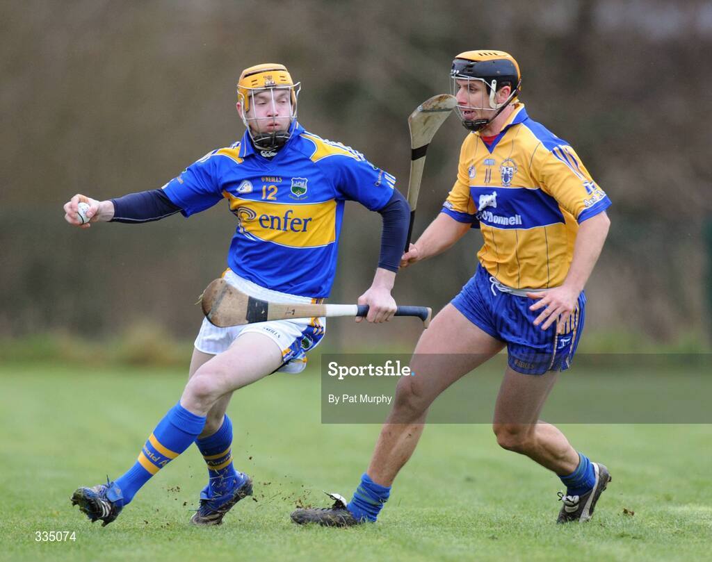25 January 2009; Lar Corbett, Tipperary, in action against Tony Griffin, Clare. Waterford Crystal Cup Hurling Final, Clare v Tipperary, Ogonnolloe, Co. Clare. Picture credit: Pat Murphy / SPORTSFILE