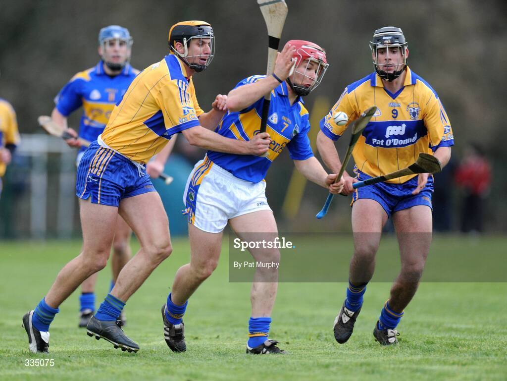 25 January 2009; Diarmaid Fitzgerald, Tipperary, in action against Tony Griffin and Brendan Bugler, right, Clare. Waterford Crystal Cup Hurling Final, Clare v Tipperary, Ogonnolloe, Co. Clare. Picture credit: Pat Murphy / SPORTSFILE