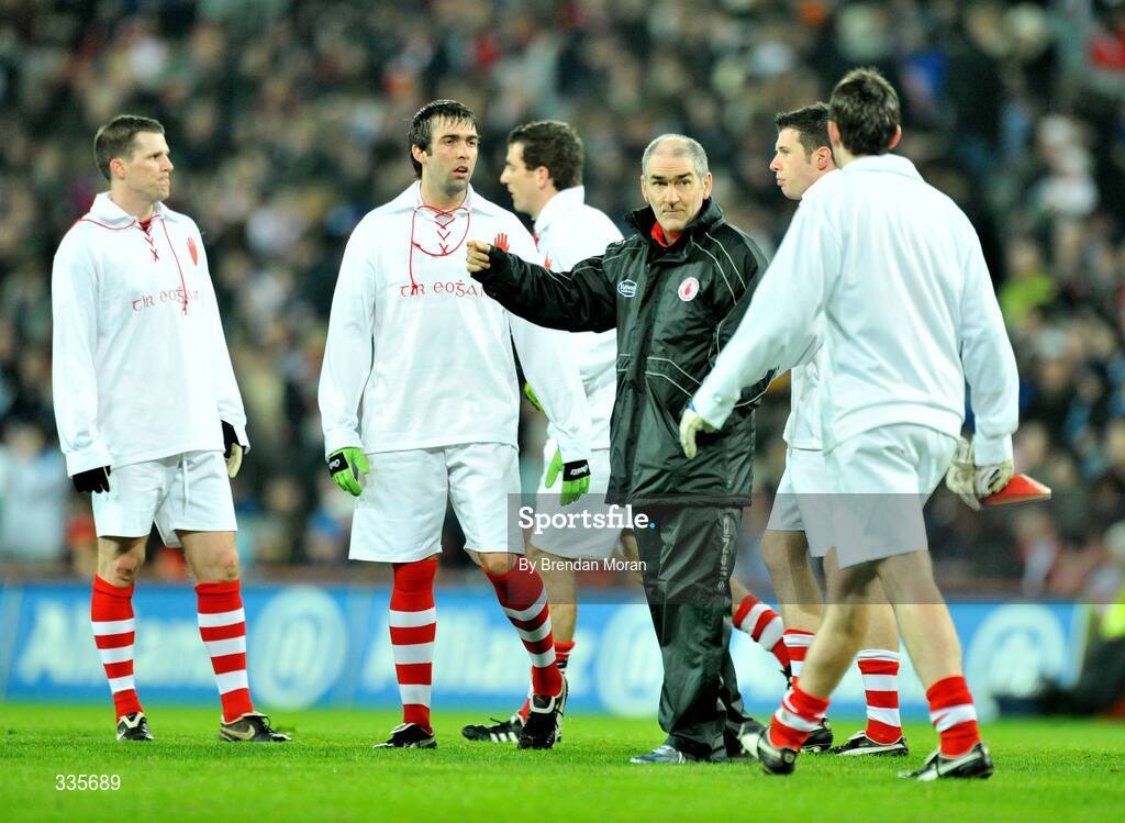 31 January 2009; Tyrone manager Mickey Harte speaks to his players as they wear 'retro playing kit' before the game. Allianz National Football League, Division 1, Round 1, Dublin v Tyrone, Croke Park, Dublin. Picture credit: Brendan Moran / SPORTSFILE