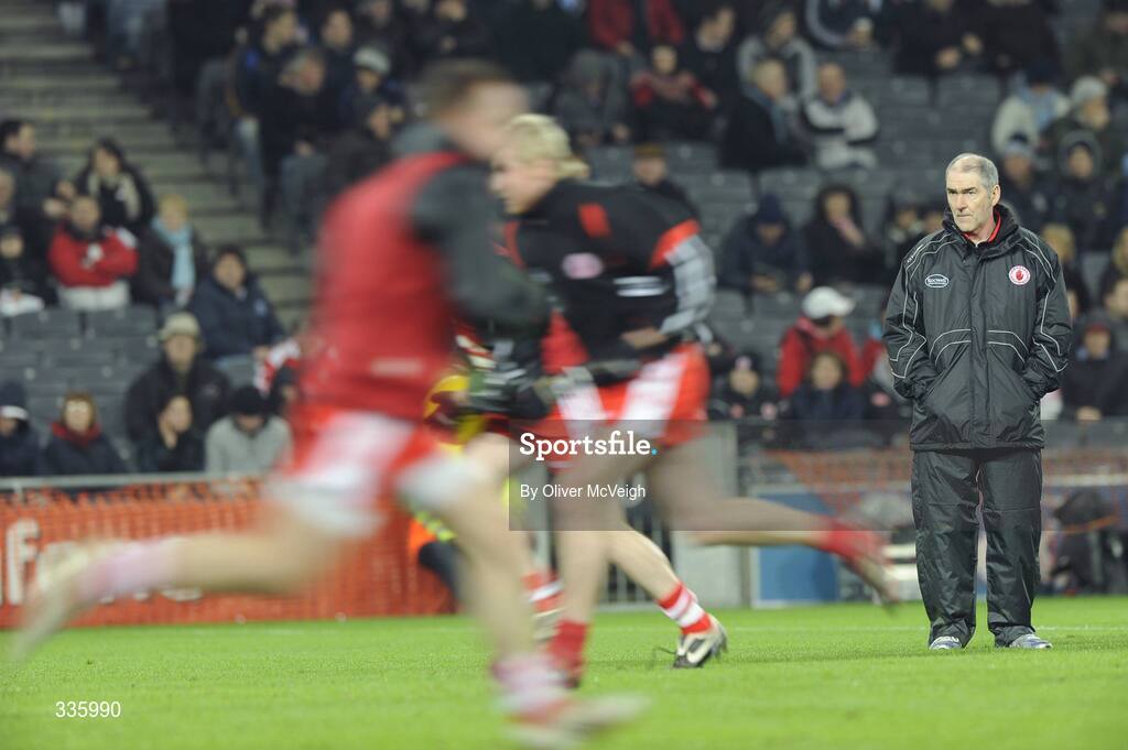31 January 2009; Tyrone Manager Mickey Harte watches his players warm up before the game. Allianz National Football League, Division 1, Round 1, Dublin v Tyrone, Croke Park, Dublin. Picture credit: Oliver McVeigh / SPORTSFILE