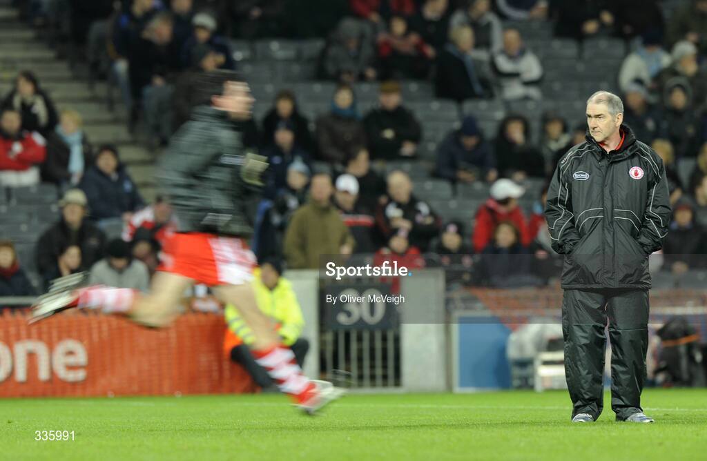 31 January 2009; Tyrone Manager Mickey Harte watches his players warm up before the game. Allianz National Football League, Division 1, Round 1, Dublin v Tyrone, Croke Park, Dublin. Picture credit: Oliver McVeigh / SPORTSFILE