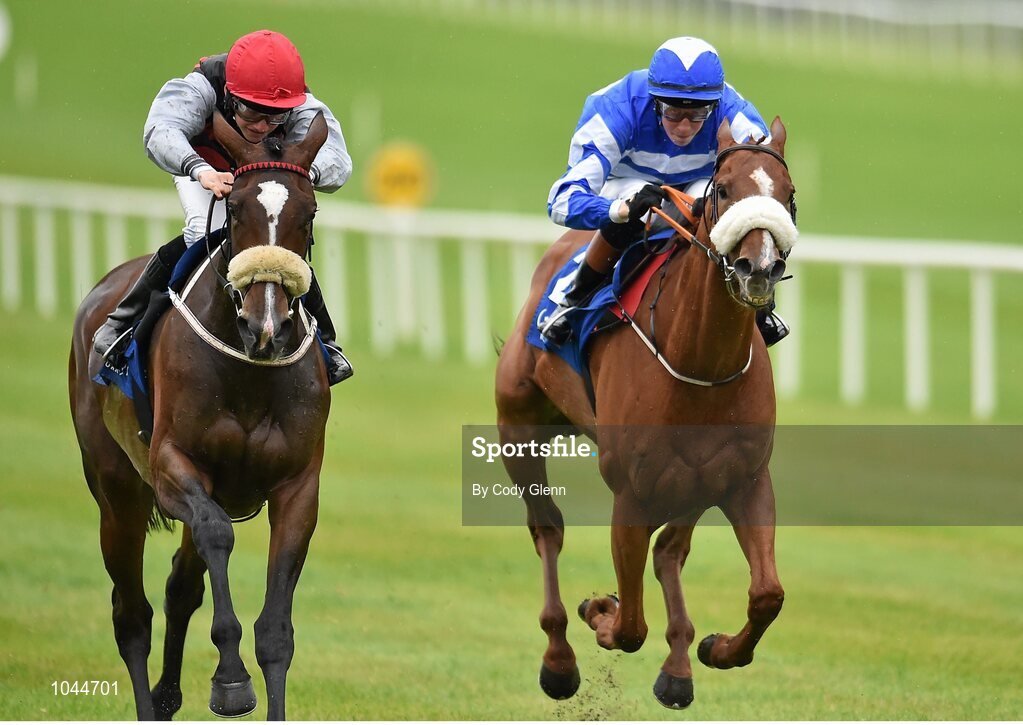 23 August 2015; Cailin Mor, left, with Sean Corby up, race alongside Chillie Billie, with Ross Coakley up, who finished second, on their way to winning the Luke & Nellie Comer Apprentice Handicap. Horse Racing from the Curragh. Curragh, Co. Kildare. Picture credit: Cody Glenn / SPORTSFILE
