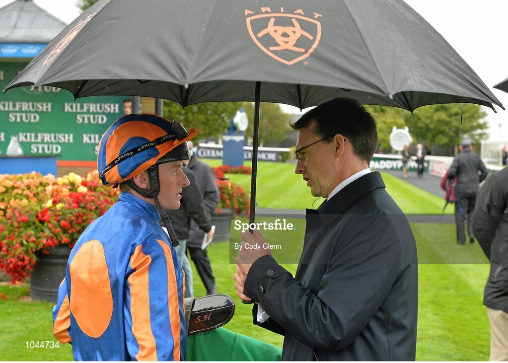 23 August 2015; Seamie Heffernan talks to trainer Aidan O'Brien after riding Found to victory in the Kilfrush Stud Royal Whip Stakes. Horse Racing from the Curragh. Curragh, Co. Kildare. Picture credit: Cody Glenn / SPORTSFILE