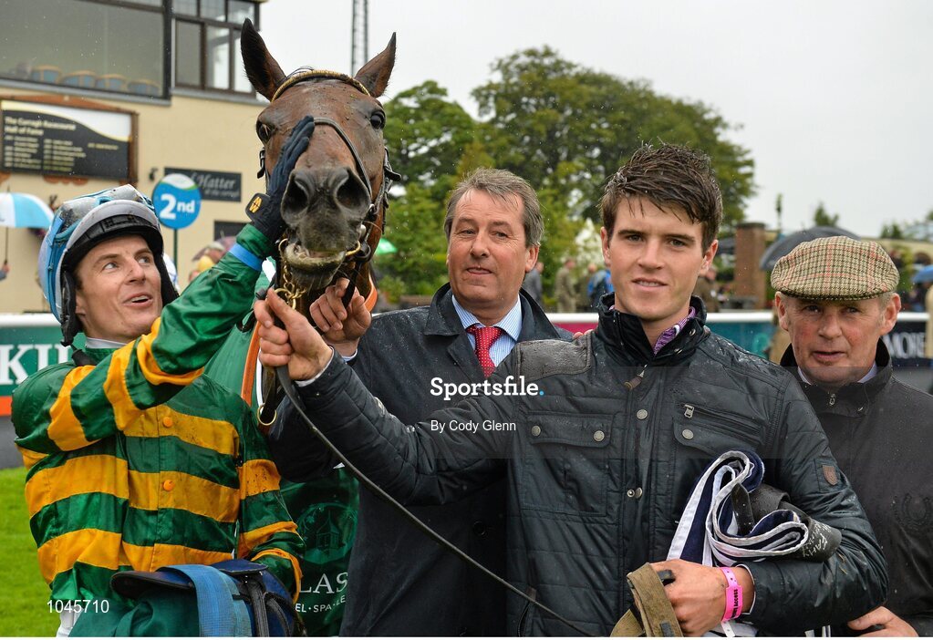 23 August 2015; Jockey Fran Berry, in the parade ring with Western Boy and the winning connections after winning the Killashee Handicap. Horse Racing from the Curragh. Curragh, Co. Kildare. Picture credit: Cody Glenn / SPORTSFILE