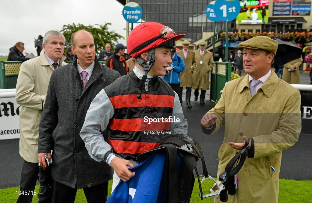 23 August 2015; Jockey Sean Corby with Trainer Michael Halford after riding Cailin Mor to victory in The Luke & Nellie Comer Apprentice Handicap. Curragh, Co. Kildare. Picture credit: Cody Glenn / SPORTSFILE