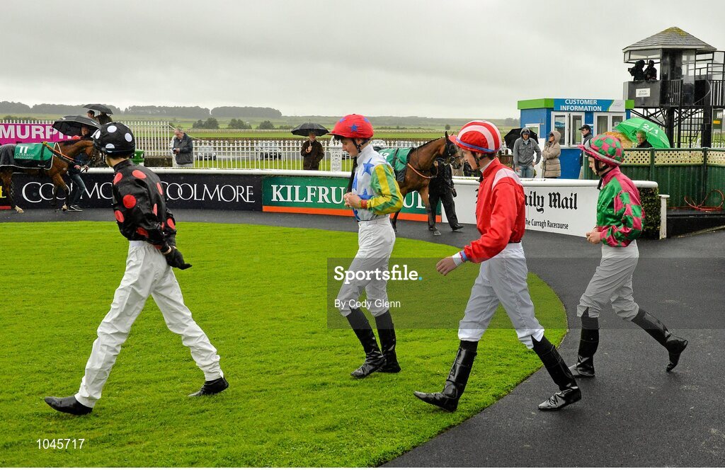 23 August 2015; Jockeys Donnacha O'Brien, from left, Dylan Hogan, Oisin Orr and Gary Phillips enter the parade ring before The Luke & Nellie Comer Apprentice Handicap. Horse Racing from the Curragh. Curragh, Co. Kildare. Picture credit: Cody Glenn / SPORTSFILE
