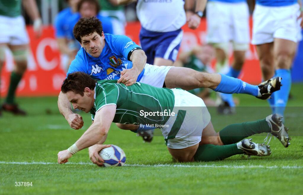 15 February 2009; Ireland's David Wallace dives over to score his side's third try of the game despite the tackle of Italy's Andrea Masi. RBS Six Nations Championship, Italy v Ireland, Stadio Flaminio, Rome, Italy. Picture credit: Matt Browne / SPORTSFILE