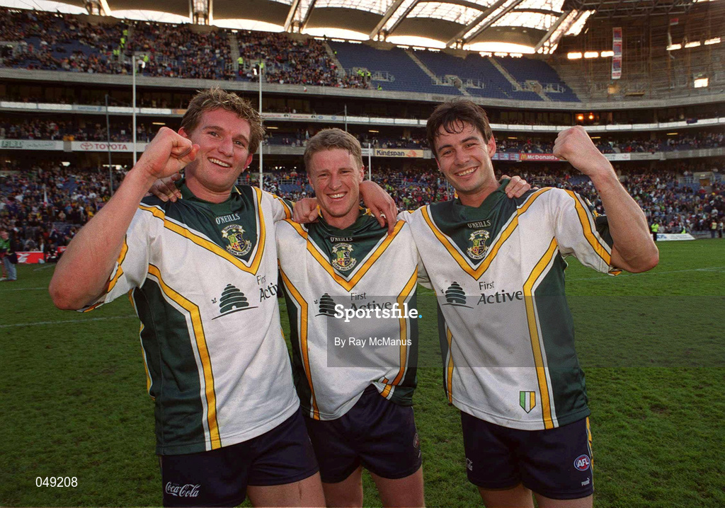 15 October 2000; Australia players, from left, Damien Healy, James Hird and Blake Carcella celebrate following their side's victory during the International Rules Series Second Test match between Ireland and Australia at Croke Park in Dublin. Photo by Ray McManus/Sportsfile