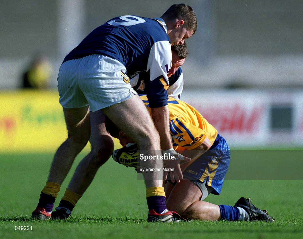 14 October 2000; Mick Galvin of Na Fianna in action against Darren Magee, left, and John O'Callaghan of Kilmacud Crokes during the Evening Herald Dublin Senior Football Championship Final match between Na Fianna and Kilmacud Crokes at Parnell Park in Dublin. Photo by Brendan Moran/Sportsfile