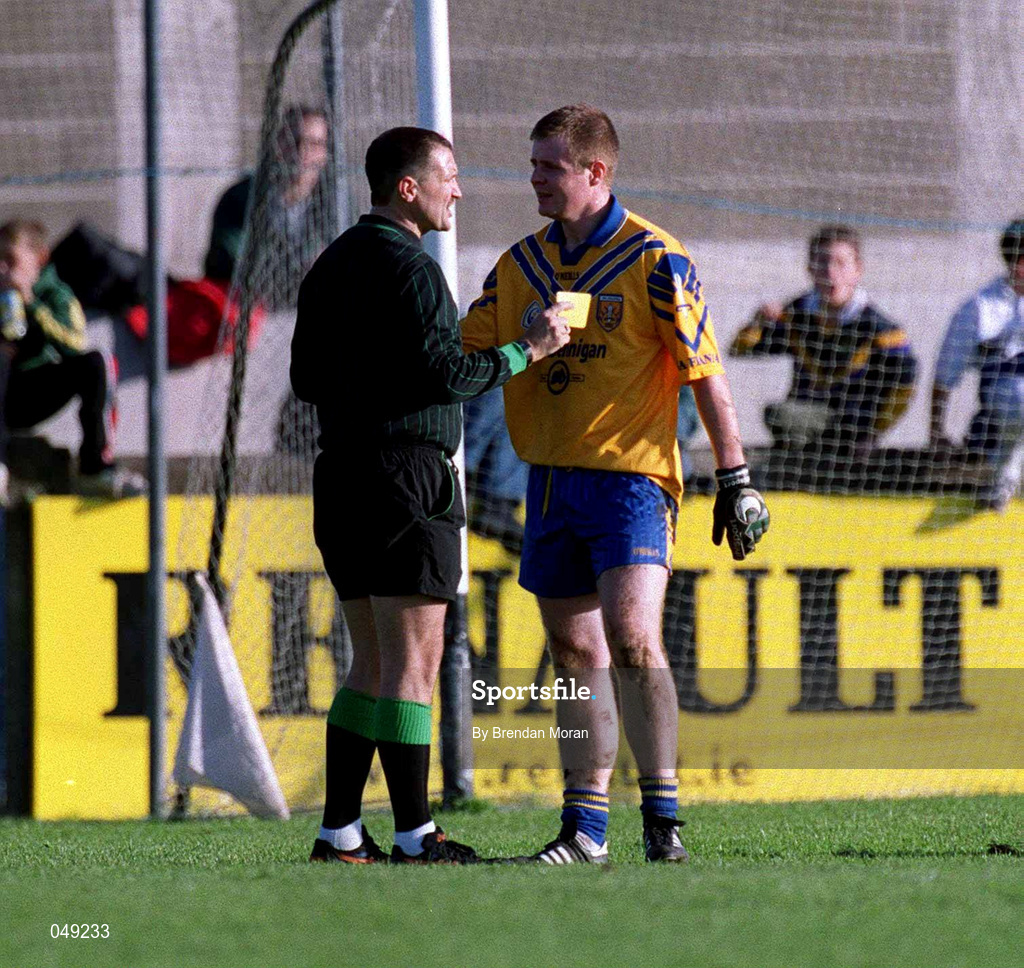 14 October 2000; Dessie Farrell of Na Fianna is shown a yellow card by referee John Rutherford during the Evening Herald Dublin Senior Football Championship Final match between Na Fianna and Kilmacud Crokes at Parnell Park in Dublin. Photo by Brendan Moran/Sportsfile
