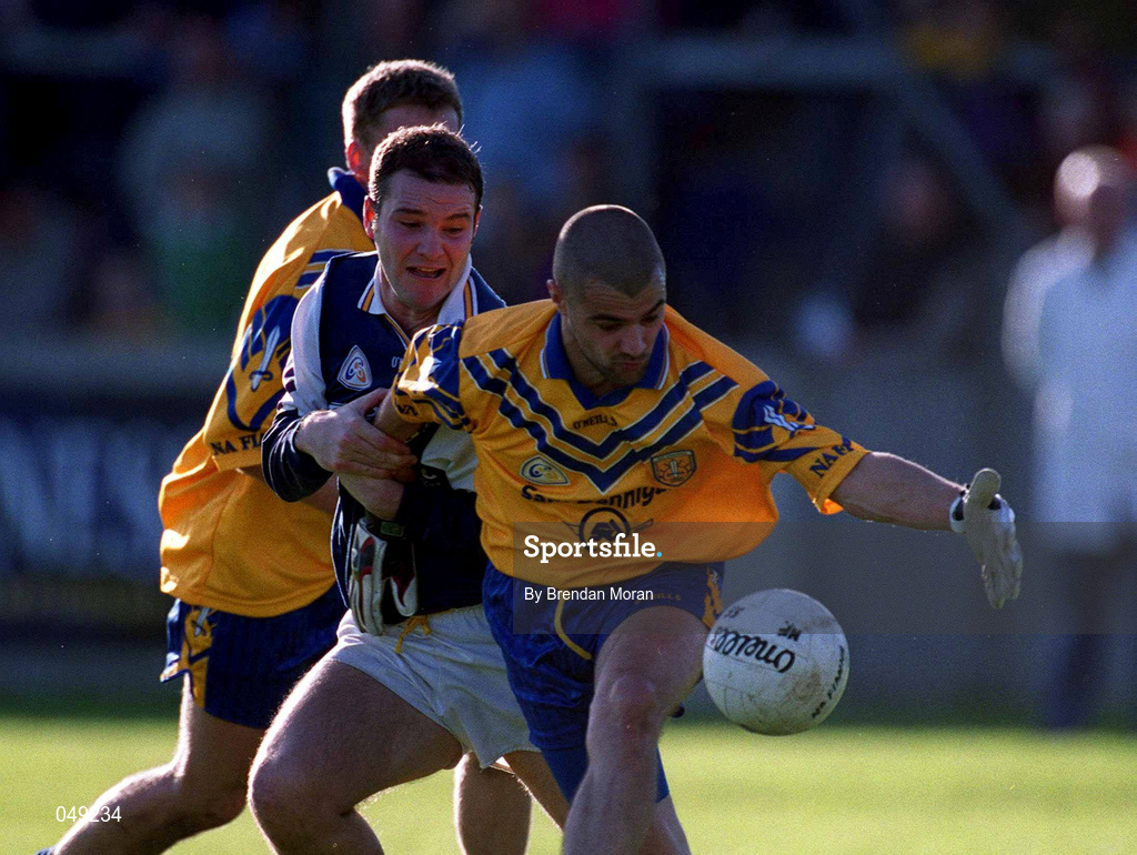 14 October 2000; Brian McManus of Na Fianna in action against Mick O'Keeffe of Kilmacud Crokes during the Evening Herald Dublin Senior Football Championship Final match between Na Fianna and Kilmacud Crokes at Parnell Park in Dublin. Photo by Brendan Moran/Sportsfile