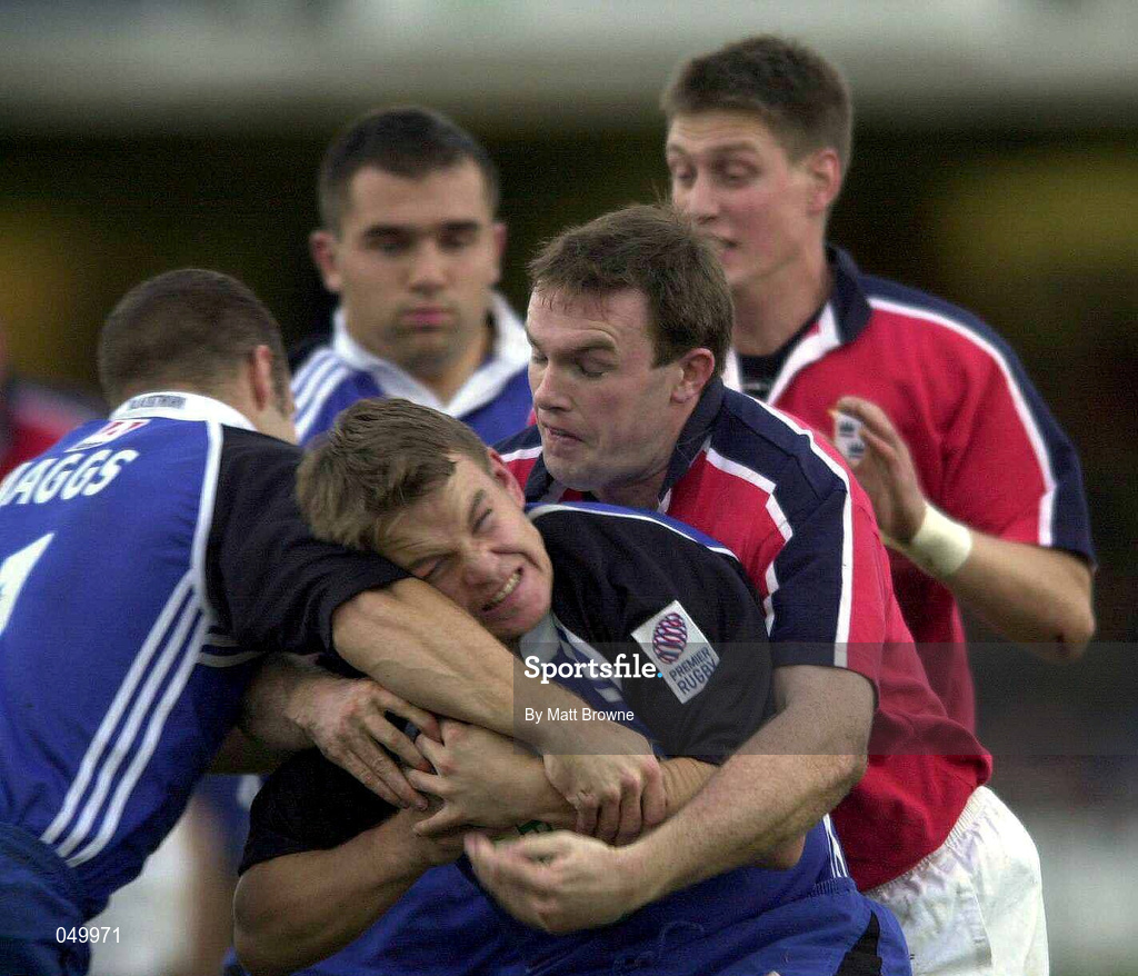 28 October 2000; Matt Perry of Bath is tackled by John Kelly of Munster during the Heineken European Cup Pool 4 Round 4 match between Bath and Munster at the Recreation Ground in Bath, England. Photo by Matt Browne/Sportsfile
