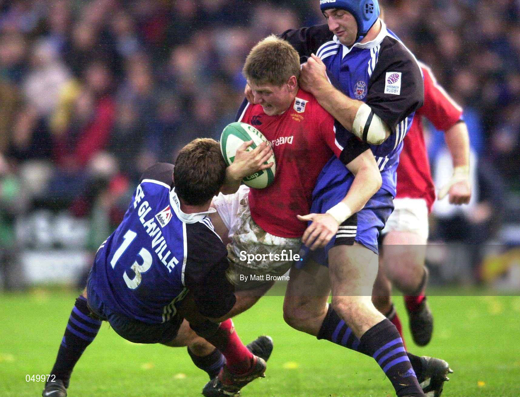 28 October 2000; Ronan O'Gara of Munster is tackled by Phil de Glanville, left, and Steve Borthwick of Bath during the Heineken European Cup Pool 4 Round 4 match between Bath and Munster at the Recreation Ground in Bath, England. Photo by Matt Browne/Sportsfile