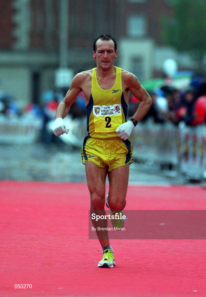 30 October 2000; Jamie Lewis crosses the line to finish the 2000 98FM Dublin City Marathon in Dublin. Photo by Brendan Moran/Sportsfile