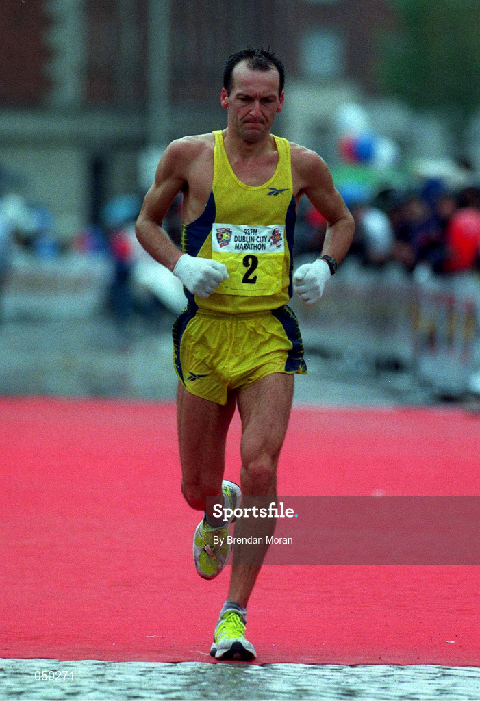30 October 2000; Jamie Lewis crosses the line to finish the 2000 98FM Dublin City Marathon in Dublin. Photo by Brendan Moran/Sportsfile