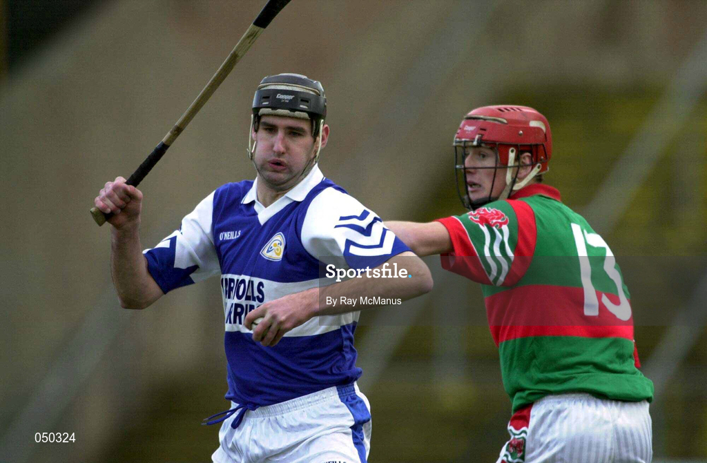 4 November 2000; Paul Cuddy of Castletown in action against Rory Hanniffy of Birr during the AIB Leinster Club Hurling Championship Quarter-Final match between Castletown and Birr at O'Moore Park in Portlaoise, Laois. Photo by Ray McManus/Sportsfile