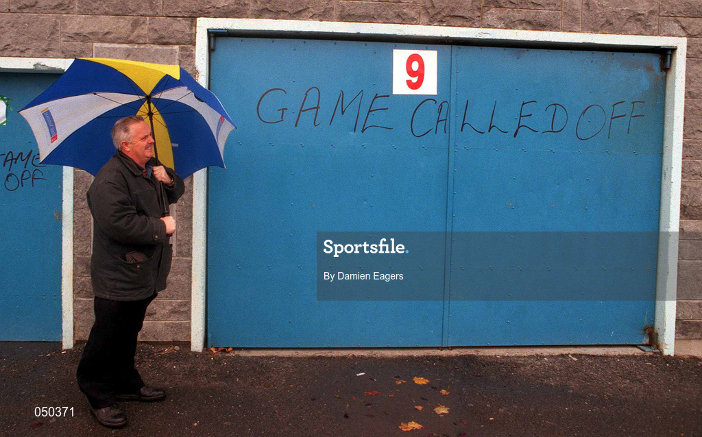 5 November 2000; Steward Jimmy Coppinger stands outside the gates to inform supporters of the cancellation, due to weather, of the Waterford Crystal South East Hurling League match between Tipperary and Cork at Semple Stadium in Thurles, Tipperary. Photo by Damien Eagers/Sportsfile