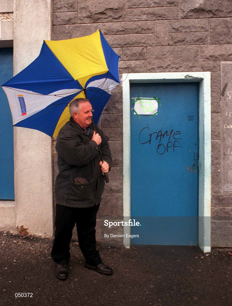 5 November 2000; Steward Jimmy Coppinger stands outside the gates to inform supporters of the cancellation, due to weather, of the Waterford Crystal South East Hurling League match between Tipperary and Cork at Semple Stadium in Thurles, Tipperary. Photo by Damien Eagers/Sportsfile