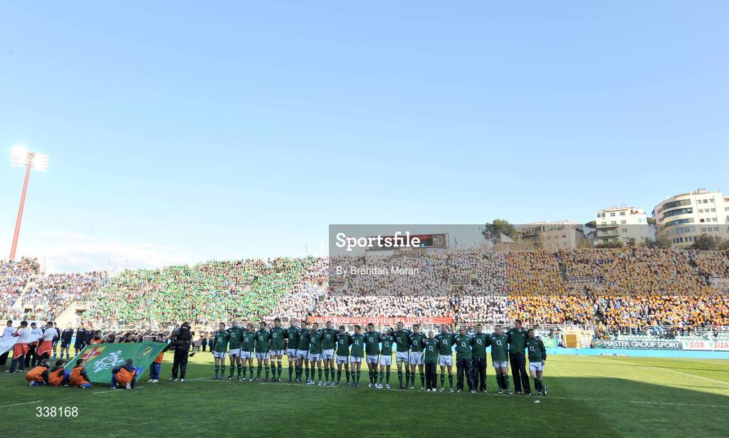 15 February 2009; The Ireland squad stand for the national anthem as the fans in the stand behind display the Irish tricolour. RBS Six Nations Championship, Italy v Ireland, Stadio Flaminio, Rome, Italy. Picture credit: Brendan Moran / SPORTSFILE