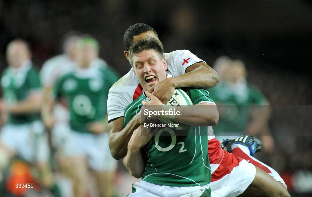28 February 2009; Ronan O'Gara, Ireland, is tackled by Delon Armitage, England. RBS Six Nations Rugby Championship, Ireland v England, Croke Park, Dublin. Picture credit: Brendan Moran / SPORTSFILE